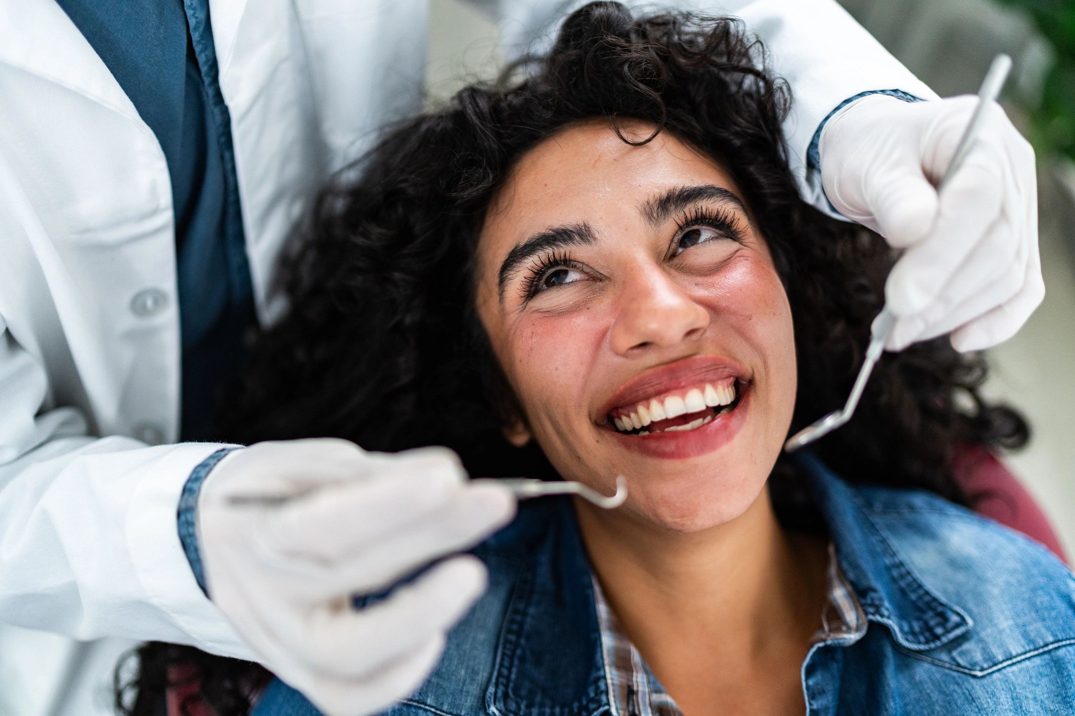 Dentist consulting with a patient in an exam room