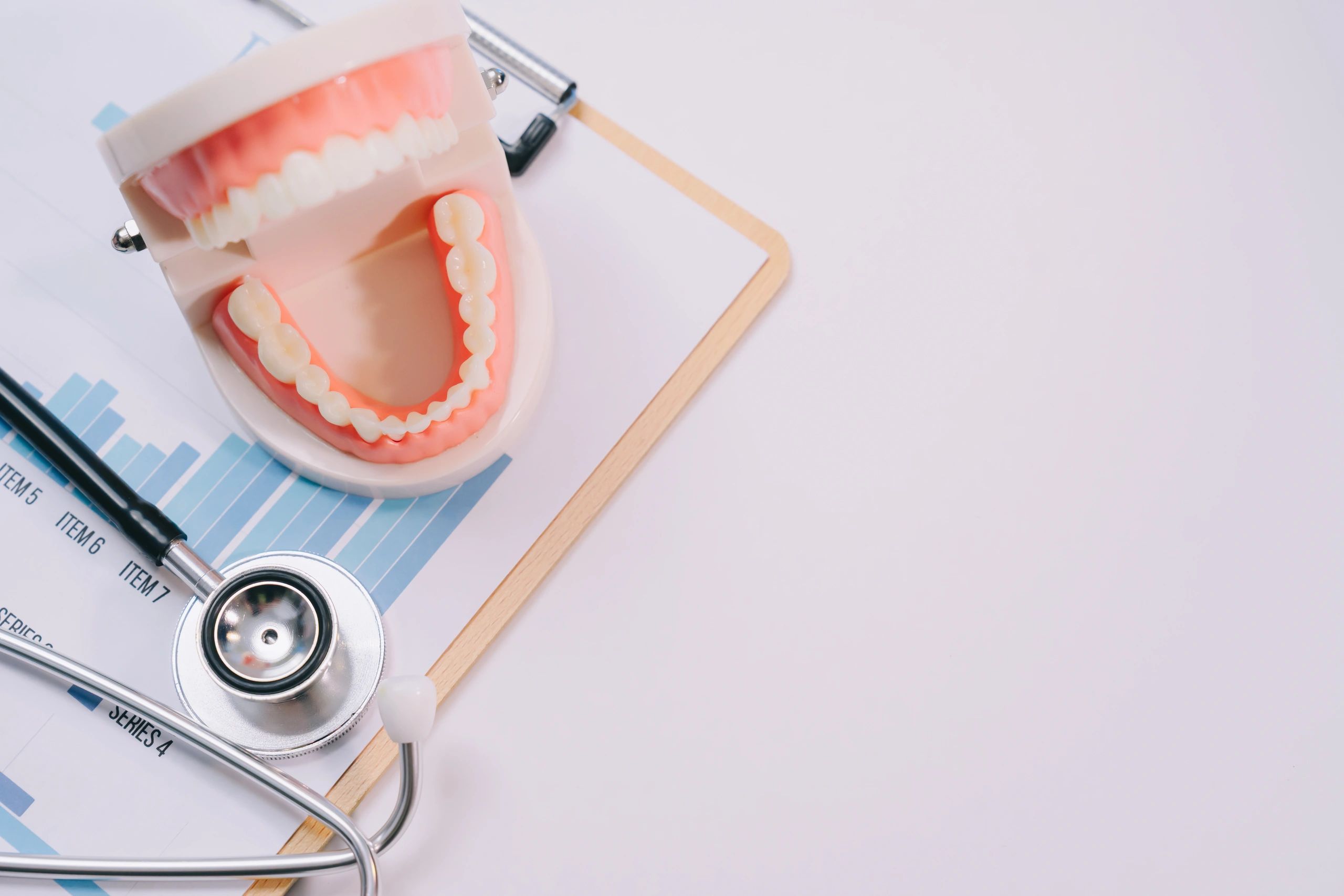Dental insurance paperwork and clipboard