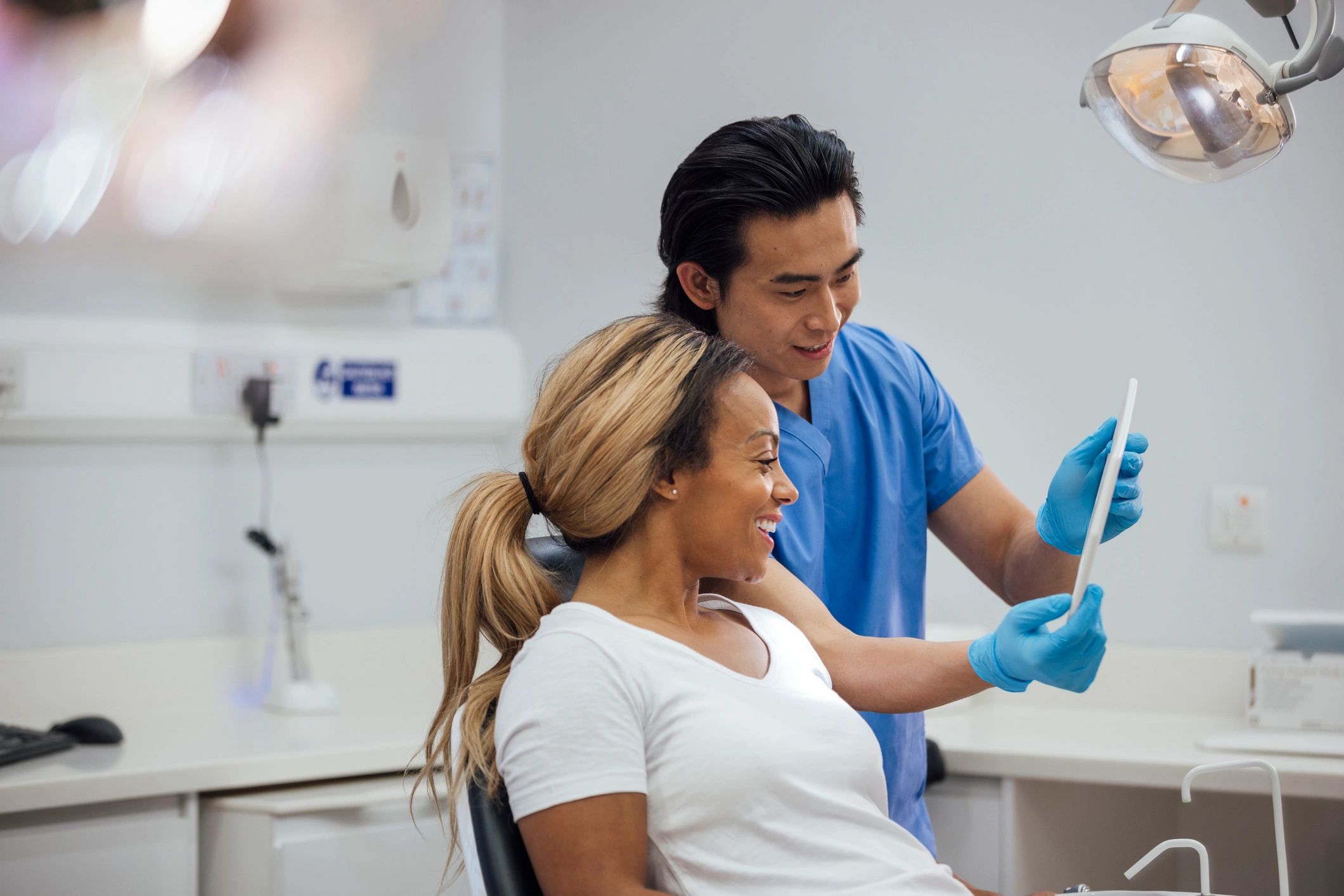 Orthodontist speaking with patient in dental clinic