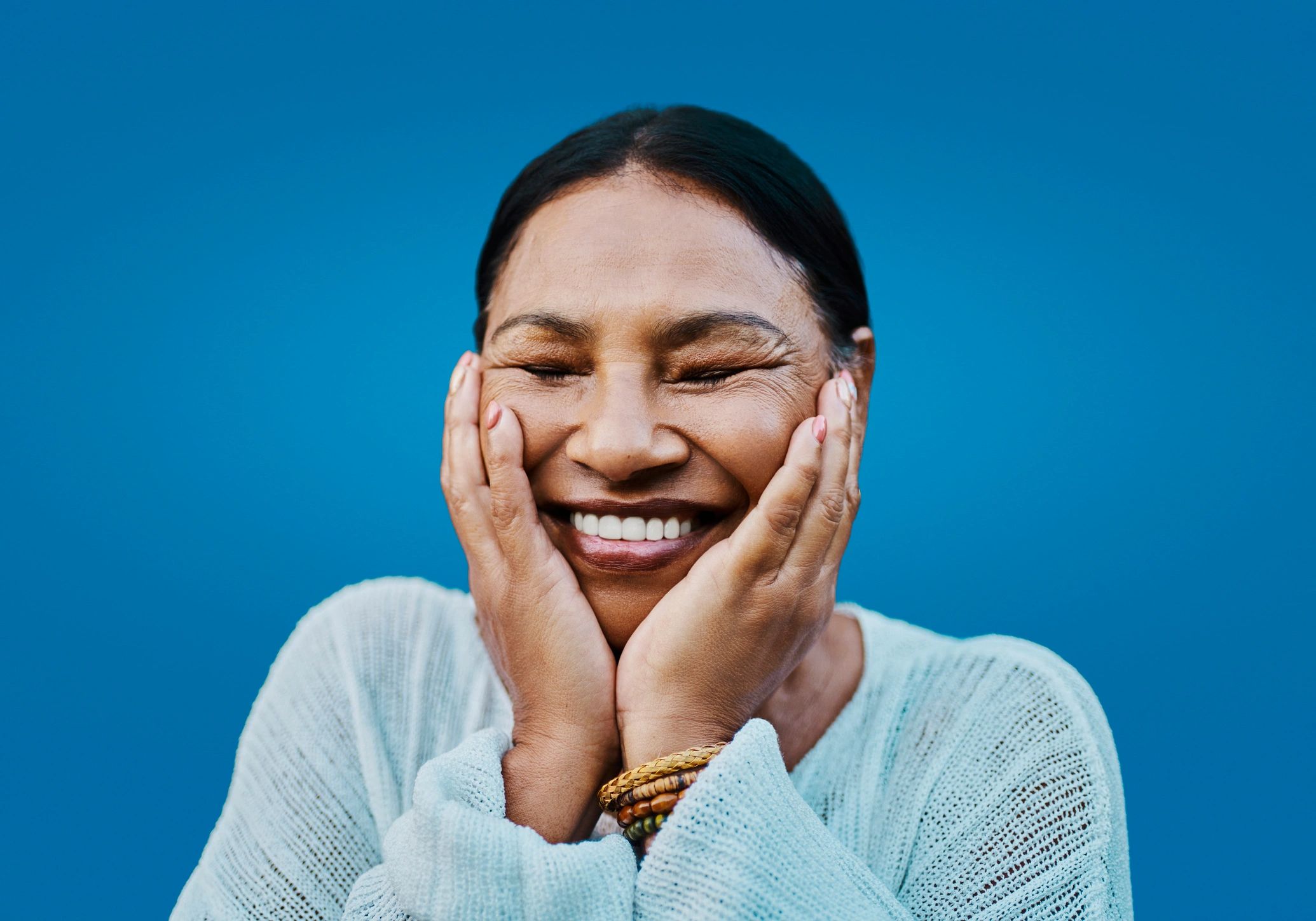 Adult patient smiling after Invisalign consultation