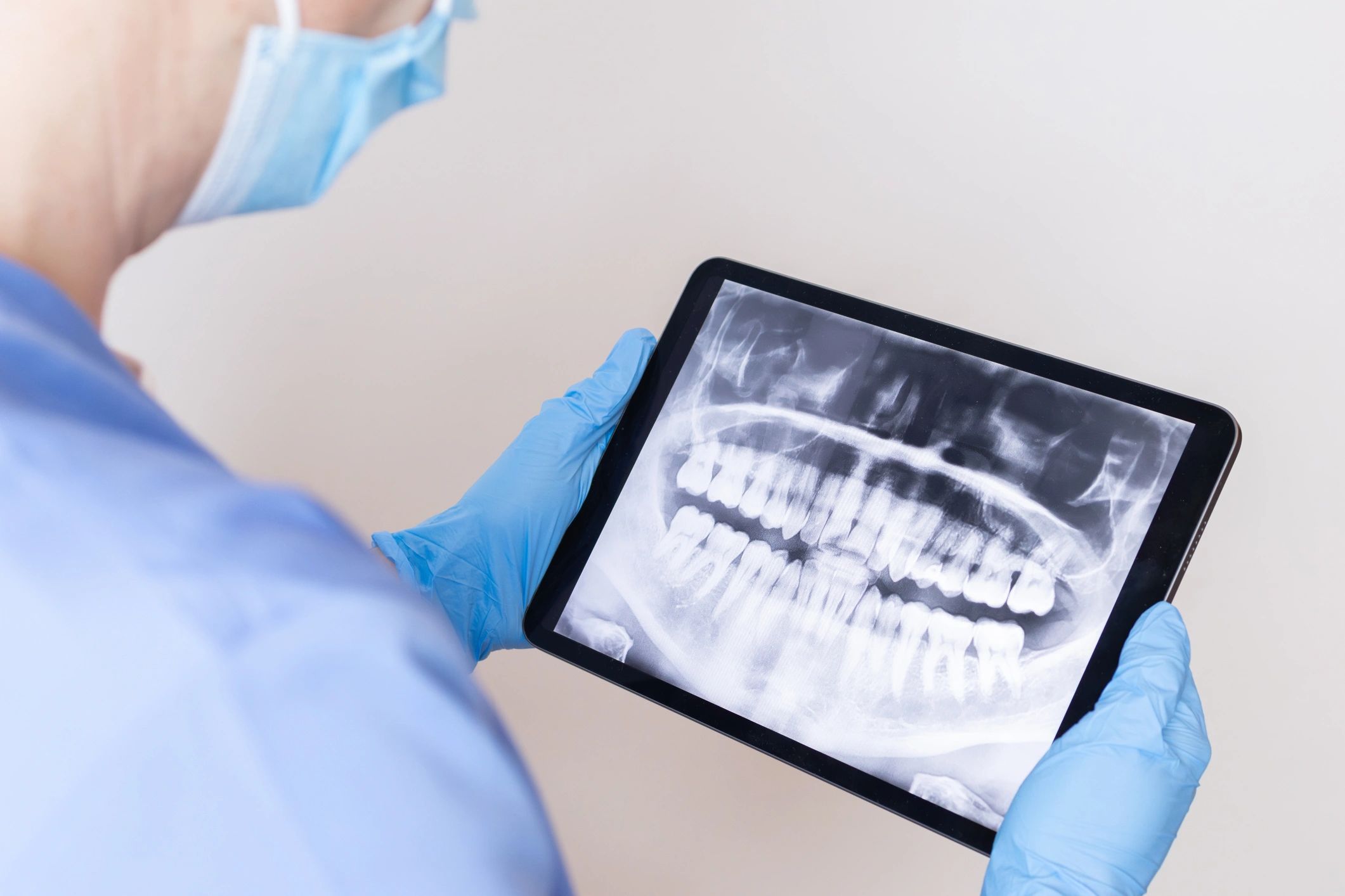 Dental professional reviewing digital dental imaging